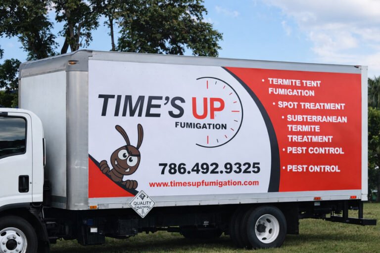What pest control companies handle wasp and hornet removal - Time’s Up fumigation service truck parked outdoors.